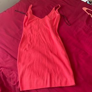 Elegant pink form fitting dress . Size M.